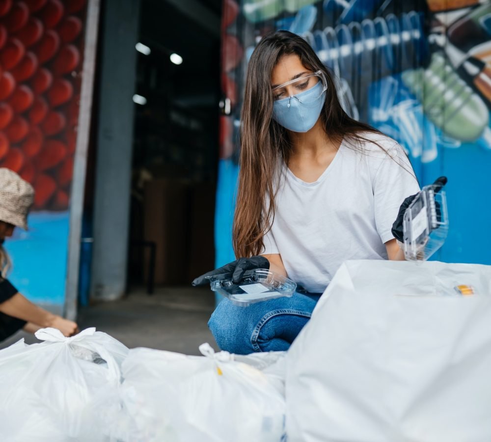 young-woman-sorting-garbage-concept-of-recycling-zero-waste.jpg